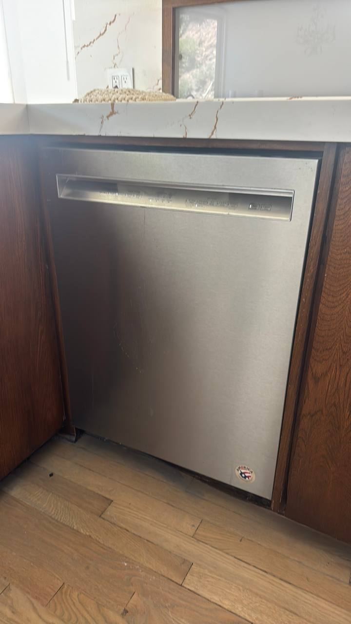 Built-in stainless dishwasher in a hillside kitchen
