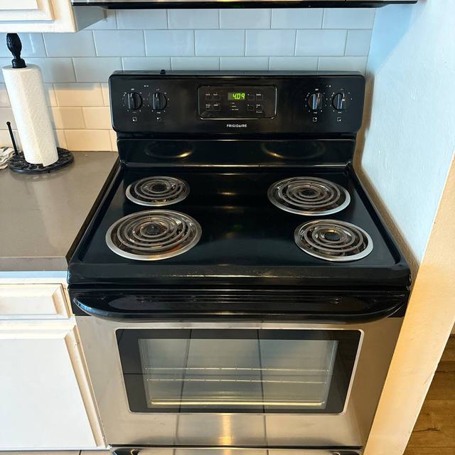 Coil-top electric range and an over-the-range microwave, the most common pairing in Valley rentals and one of our most frequent calls
