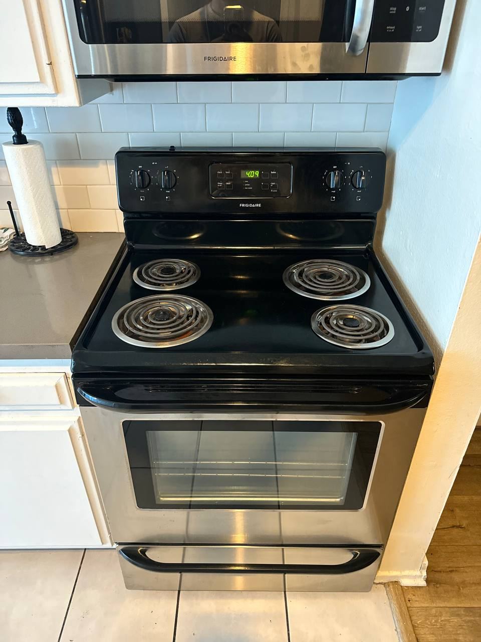Over-the-range microwave installed above an electric range