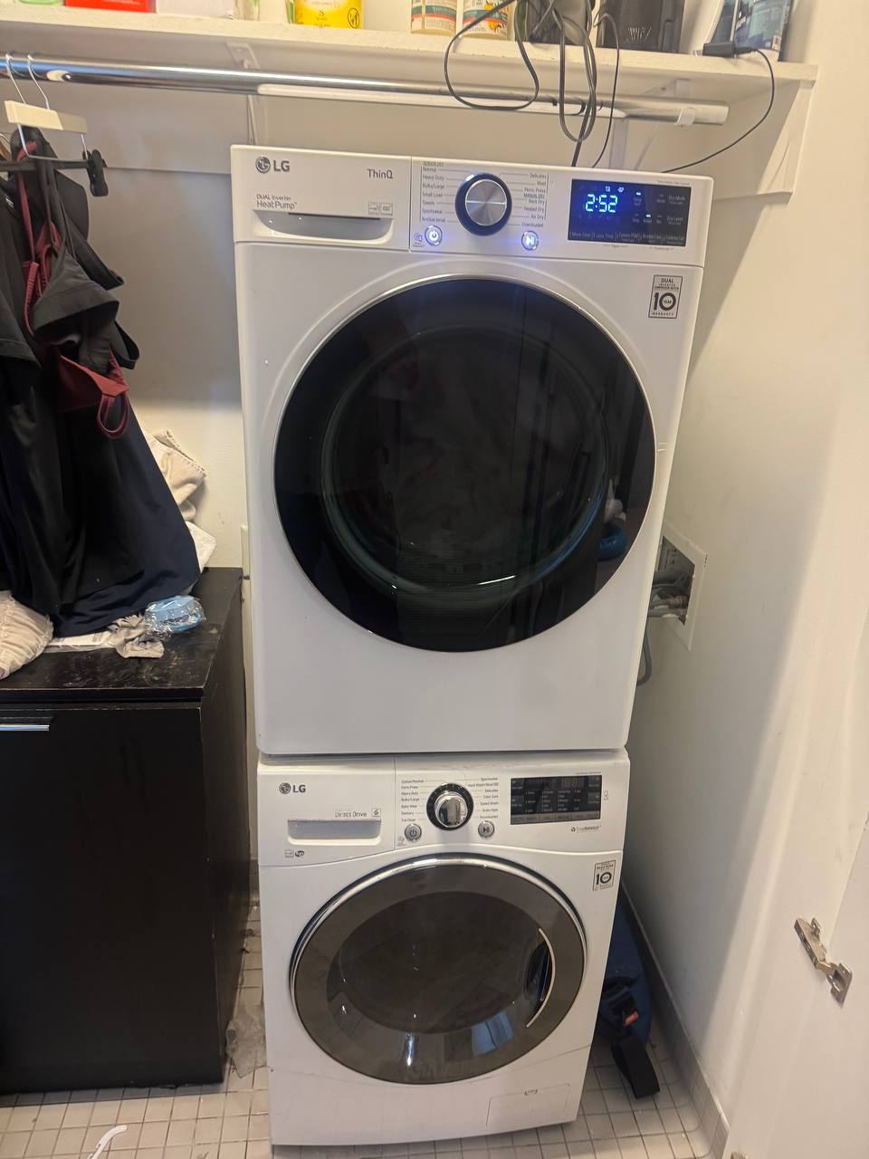 Stacked LG washer and heat pump dryer in a laundry closet