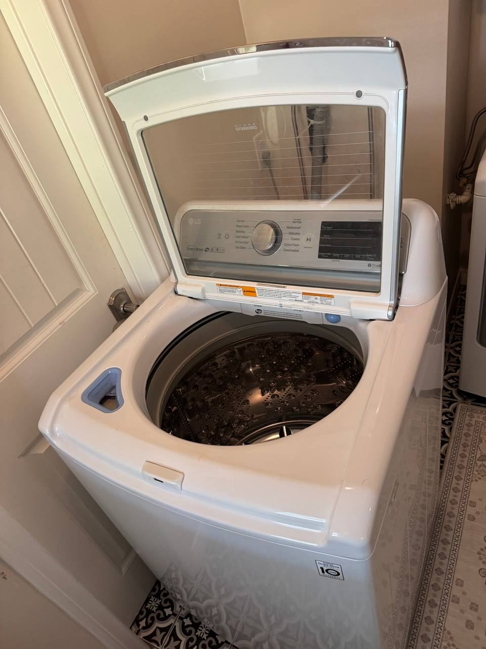 LG top load washer with the lid open
